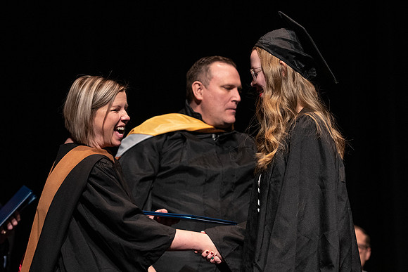Graduates receive their diplomas during Performing and Visual Arts convocation.