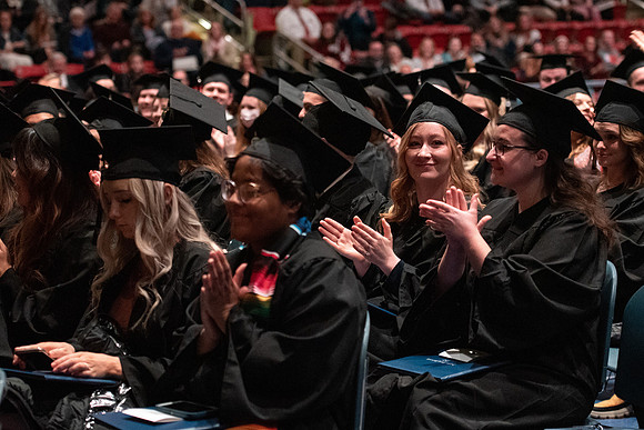 Graduates receive their diplomas during Performing and Visual Arts convocation.