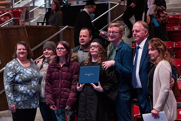 Graduates receive their diplomas during Performing and Visual Arts convocation.