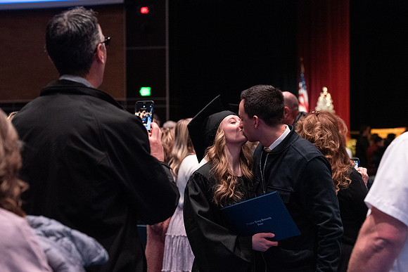 Graduates receive their diplomas during Performing and Visual Arts convocation.
