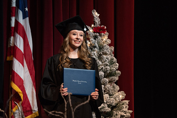 Graduates receive their diplomas during Performing and Visual Arts convocation.