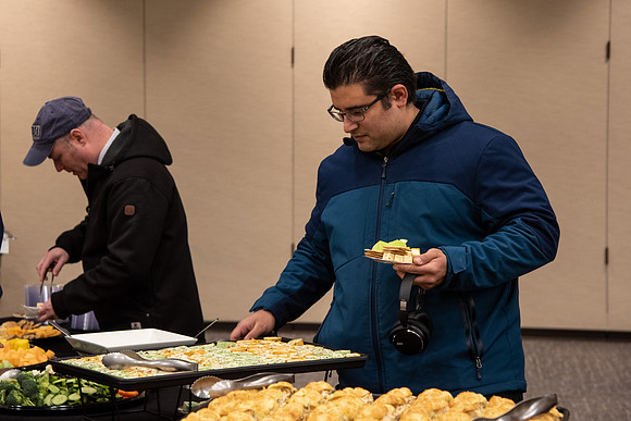 BYU-Idaho Employees enjoy a Christmas gathering in the Taylor Building.