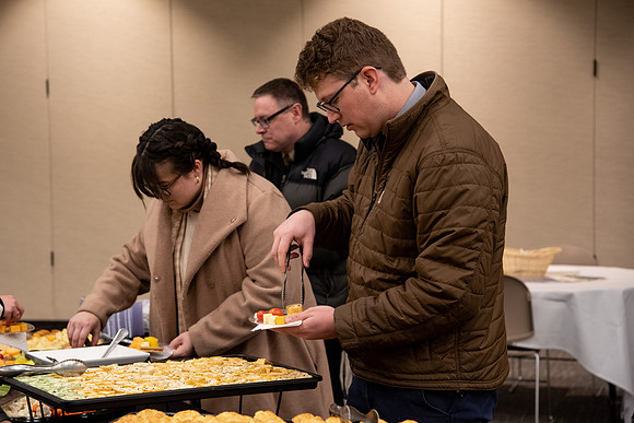 BYU-Idaho Employees enjoy a Christmas gathering in the Taylor Building.