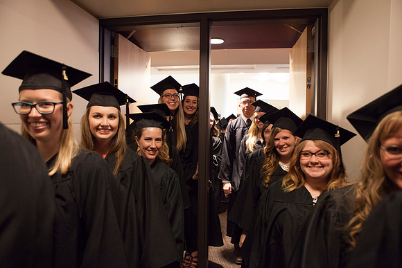 Students gather in the I-Center before Commencement begins.