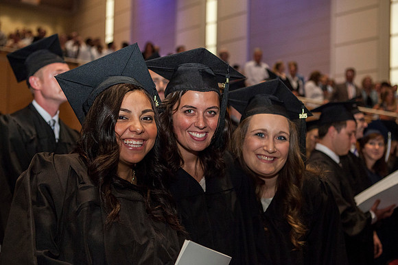 Students gather in the I-Center before Commencement begins.
