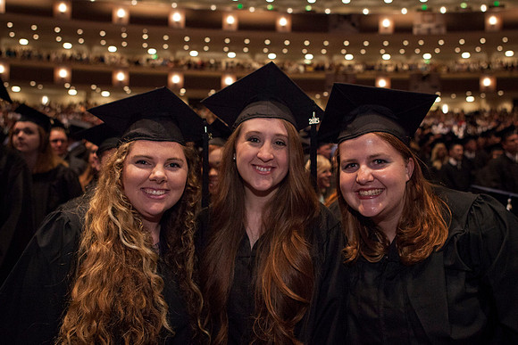 Students gather in the I-Center before Commencement begins. Photo by Tyler Rickenbach