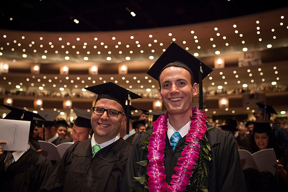 Students gather in the I-Center before Commencement begins. Photo by Tyler Rickenbach