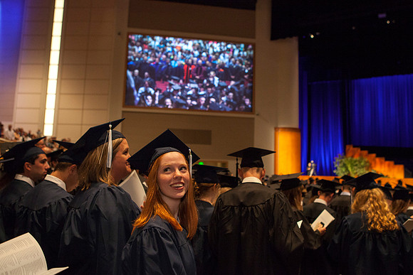 Students gather in the I-Center before Commencement begins. Photo by Tyler Rickenbach