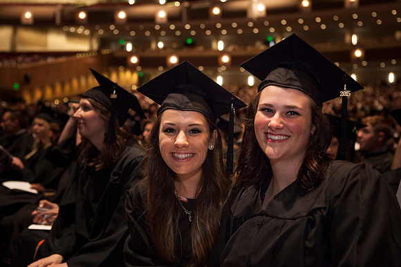 Graduates smile just before Commencement begins in the I-Center. Photo by Tyler Rickenbach