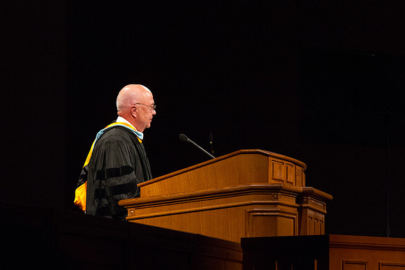 Fenton L. Broadhead, Academic Vice President of BYU-Idaho, gives his seal of approval to the graduates gather in the I-Center. Photo by Tyler Rickenbach