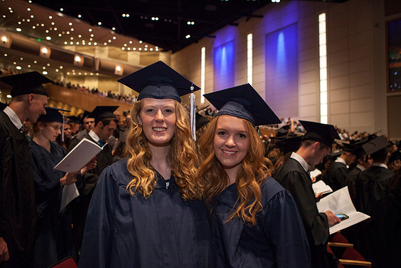 Students gather in the I-Center before Commencement begins. Photo by Tyler Rickenbach