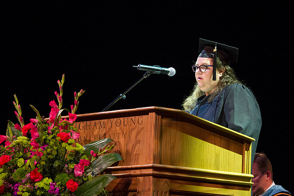 Student Speaker, Jenni Speer, a University Studies Graduate, speaks to graduates during Convocation in the Kirkham Auditorium.