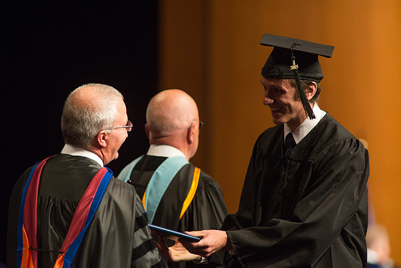 Graduates of the College of Agriculture and LIfe Sciences receive their diplomas.