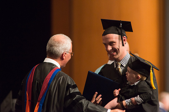 Graduates of the College of Agriculture and LIfe Sciences receive their diplomas.