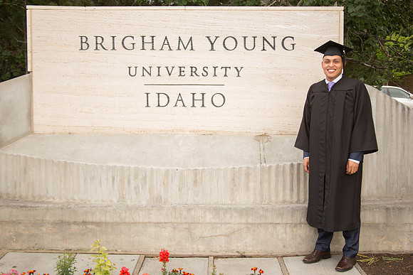 Bryan Funez stands in front of the BYU-Idaho sign.