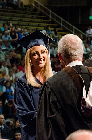 Students recieve their Diplomas during the College of Business and Communication Convocation.