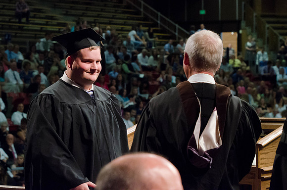Students recieve their Diplomas during the College of Business and Communication Convocation.