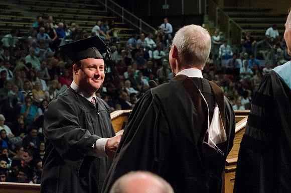Students recieve their Diplomas during the College of Business and Communication Convocation.