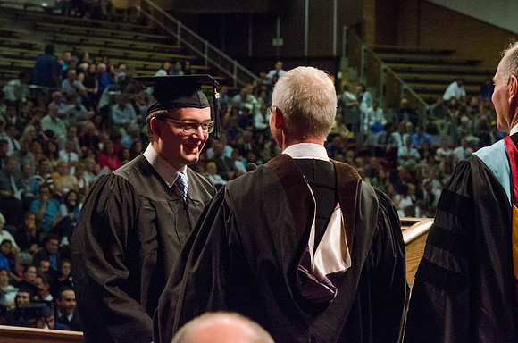 Students recieve their Diplomas during the College of Business and Communication Convocation.