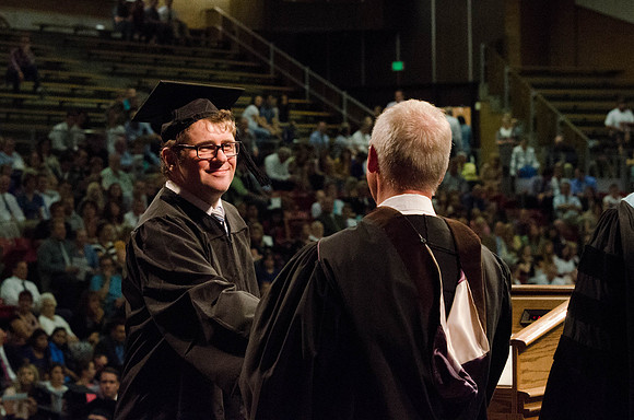 Students recieve their Diplomas during the College of Business and Communication Convocation.