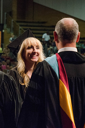 Students recieve their Diplomas during the College of Business and Communication Convocation.