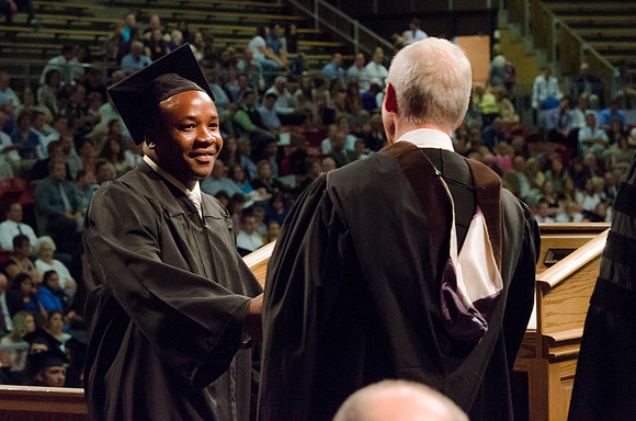Students recieve their Diplomas during the College of Business and Communication Convocation.