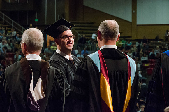 Students recieve their Diplomas during the College of Business and Communication Convocation.