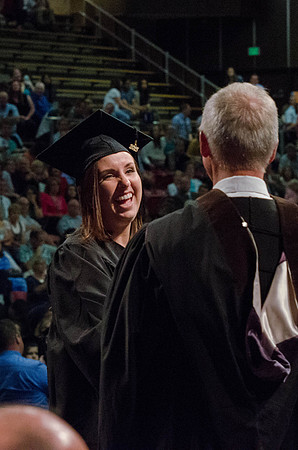 Students recieve their Diplomas during the College of Business and Communication Convocation.