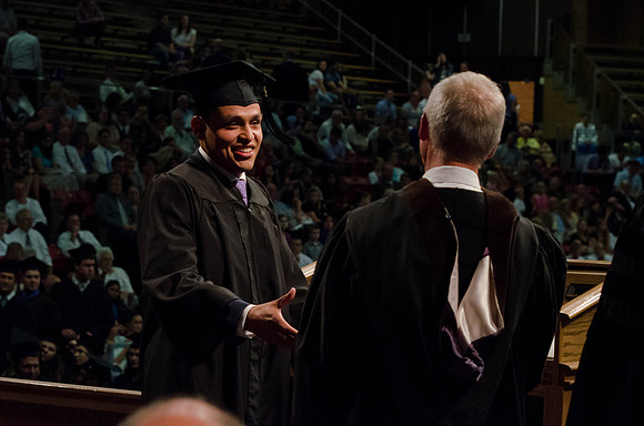 Business Management Graduate Bryan Funez recieves his diploma.