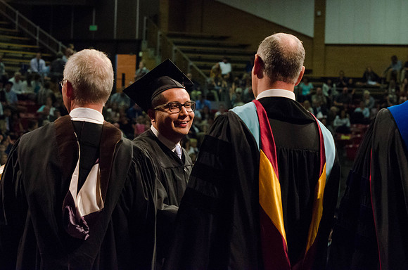 Students recieve their Diplomas during the College of Business and Communication Convocation.