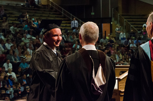 Students recieve their Diplomas during the College of Business and Communication Convocation.