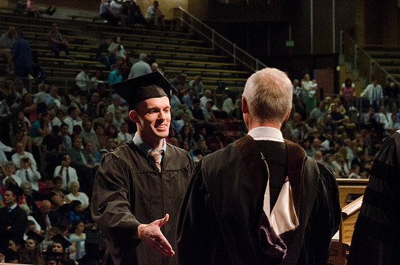 Students recieve their Diplomas during the College of Business and Communication Convocation.