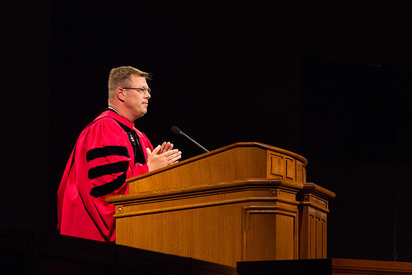 President Gilbert speaks to graduates during the BYU-Idaho Graduation in the I-Center. Photo by Tyler Rickenbach