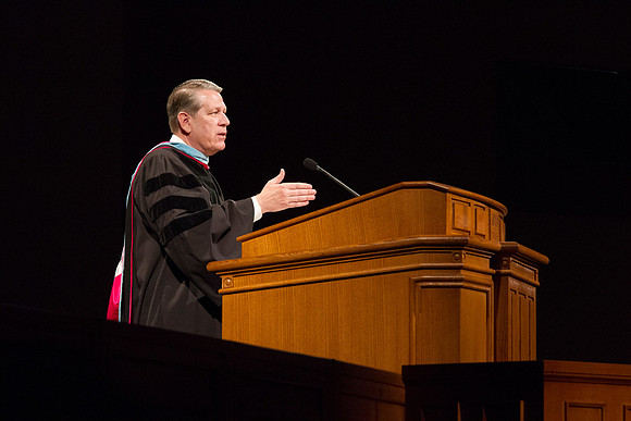 Elder Donald L. Hallstrom, a member of the Presidency of the Seventy, addresses graduates during Commencement in the BYUI I-Center. Photo by Tyler Rickenbach