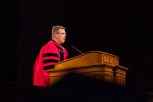 President Gilbert speaks to graduates during the BYU-Idaho Graduation in the I-Center. Photo by Tyler Rickenbach
