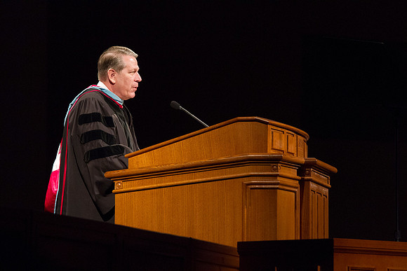 Elder Donald L. Hallstrom, a member of the Presidency of the Seventy, addresses graduates during Commencement in the BYUI I-Center. Photo by Tyler Rickenbach
