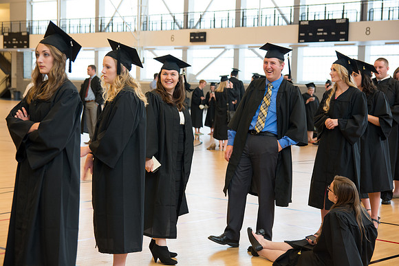 Graduates waiting before commencement ceremony. Photo by Ryan Chase.
