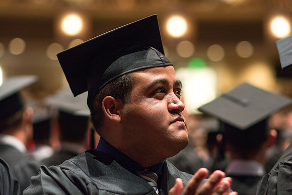 Brigham Young University-Idaho graduates give thanks to parents and teachers at Commencement ceremony. Photo by Ryan Chase