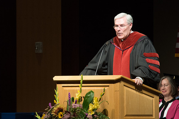 Edwin A. Sexton, Assosiate Academic Vice President for Cirriculum and Online Learning, addresses graduates of the College of Laguage and Letters. Photo by Ryan Chase.