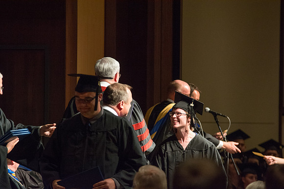 Graduates of the College of Language and Letters receiving their diplomas.