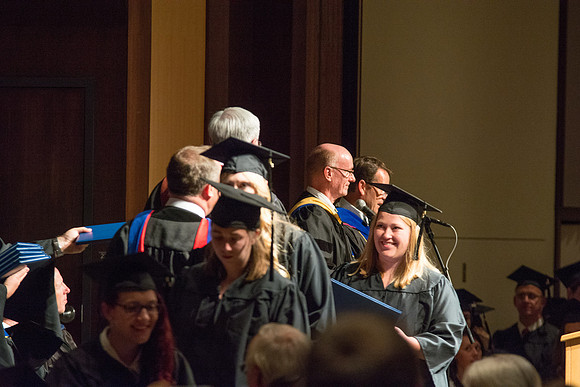 Graduates of the College of Language and Letters receiving their diplomas.