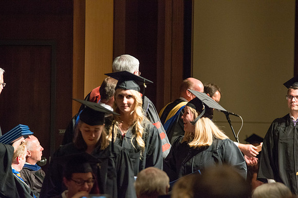 Graduates of the College of Language and Letters receiving their diplomas.