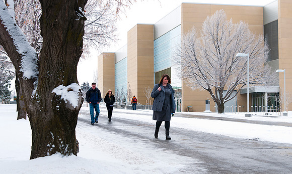 Students on campus during winter with BYUI Center in background