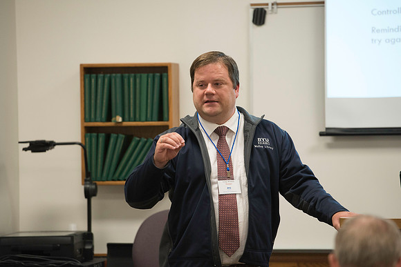 Faculty gather in the Hinckley Building for a conference to learn from their peers. Instructor Craig Whetten