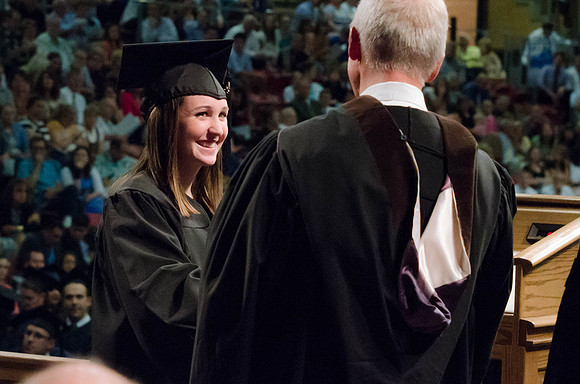 Students recieve their Diplomas during the College of Business and Communication Convocation.