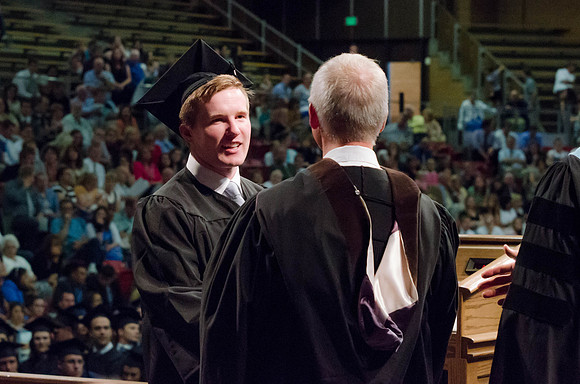 Students recieve their Diplomas during the College of Business and Communication Convocation.