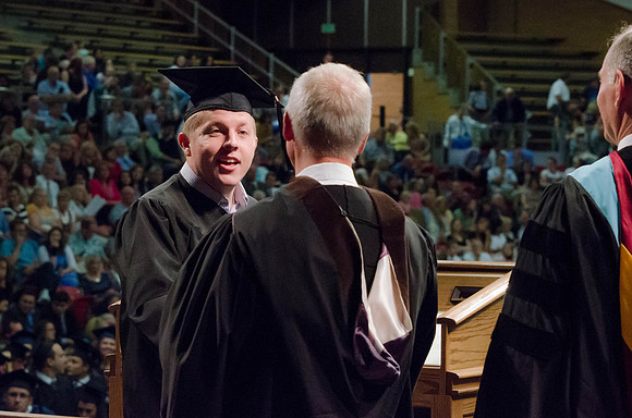 Students recieve their Diplomas during the College of Business and Communication Convocation.
