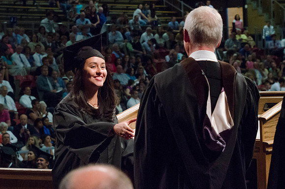 Students recieve their Diplomas during the College of Business and Communication Convocation.
