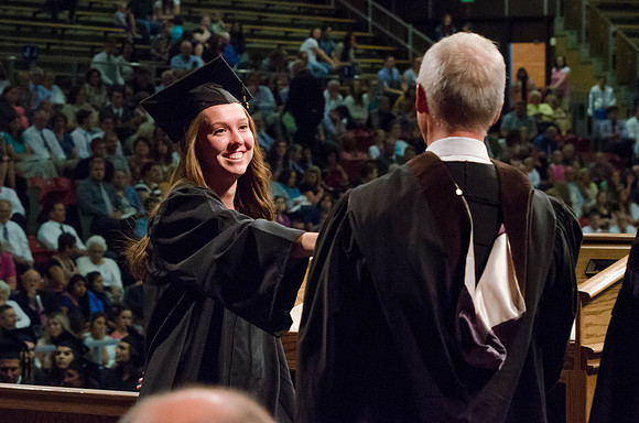Students recieve their Diplomas during the College of Business and Communication Convocation.