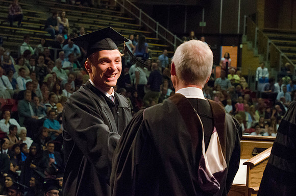 Students recieve their Diplomas during the College of Business and Communication Convocation.